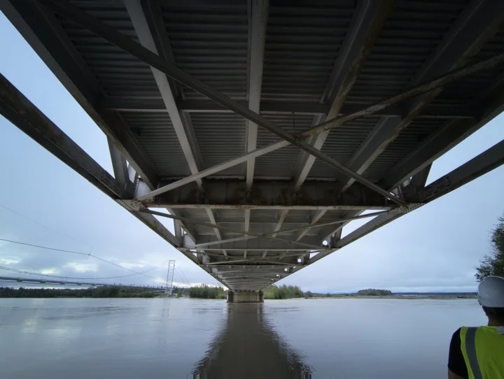 Underside of an Alaska bridge over a river